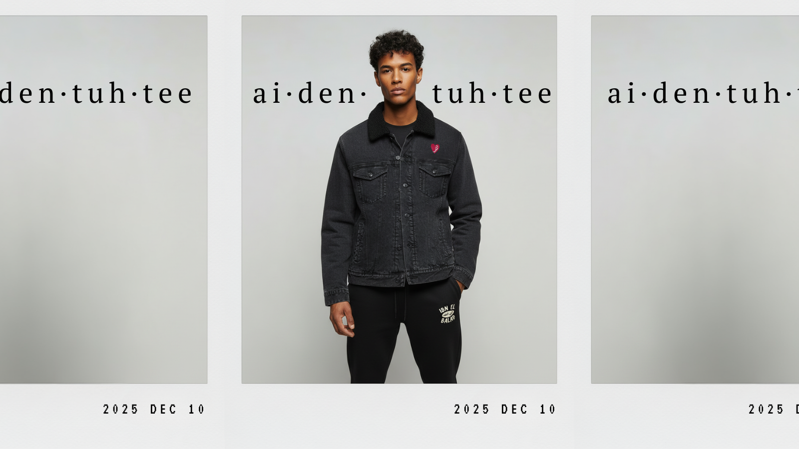 Person wearing a black jacket with 'ai-den-tuh-tee' branding on a gray background. Arab Hyphenated 